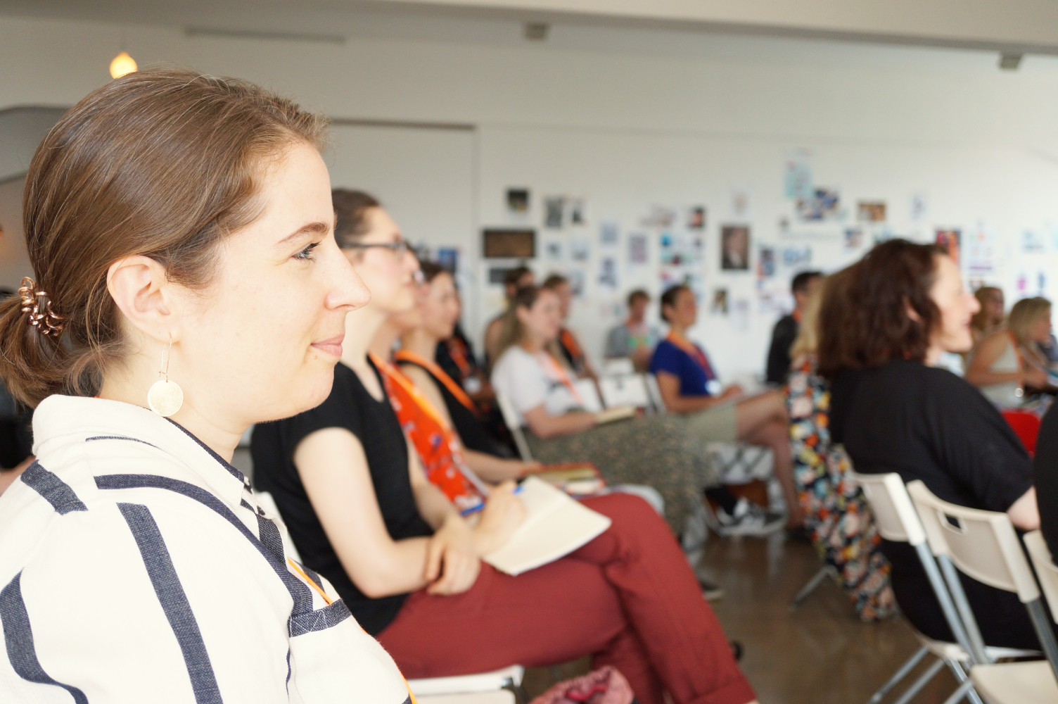 Annemarie listening to a talk at the Berlin Kreativ Konferenz 2018